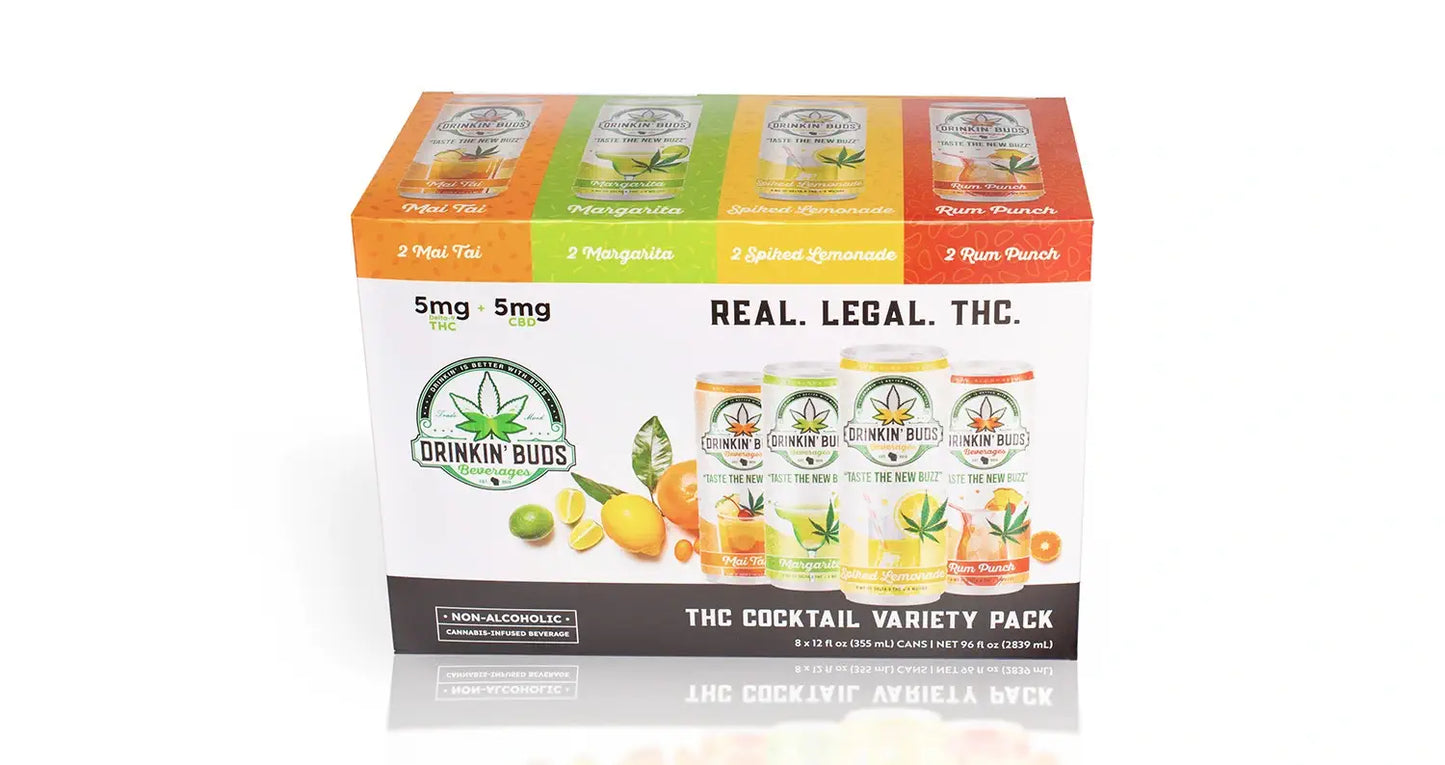 The image displays the "Drinkin' Buds Beverages" THC Cocktail Variety Pack from a front view, emphasizing "Real. Legal. THC." and the four flavors: Mai Tai, Margarita, Spiked Lemonade, and Rum Punch. Each drink contains 5 mg of THC and 5 mg of CBD, with a vibrant design showcasing citrus and tropical fruits.