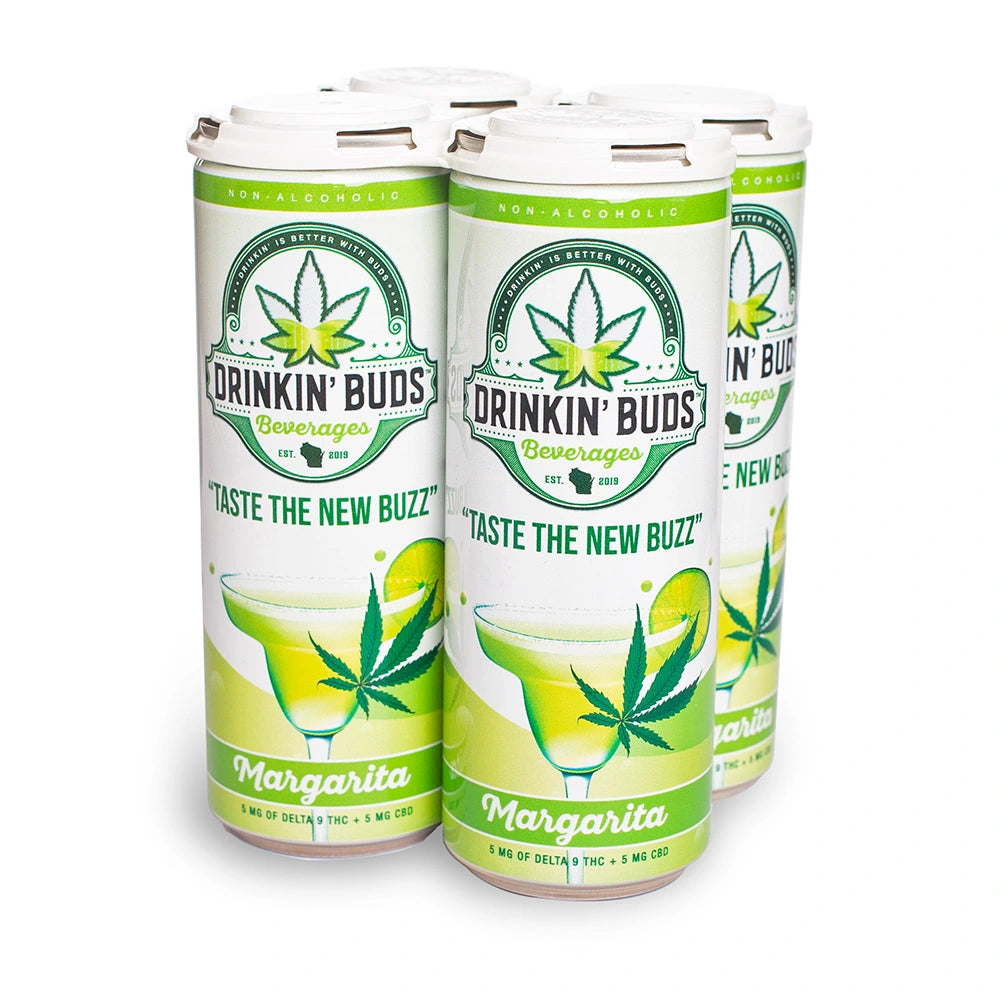 A four-pack of Drinkin’ Buds Margarita cans, a non-alcoholic THC and CBD-infused beverage, featuring a cannabis leaf logo and an illustration of a classic margarita with a lime garnish.