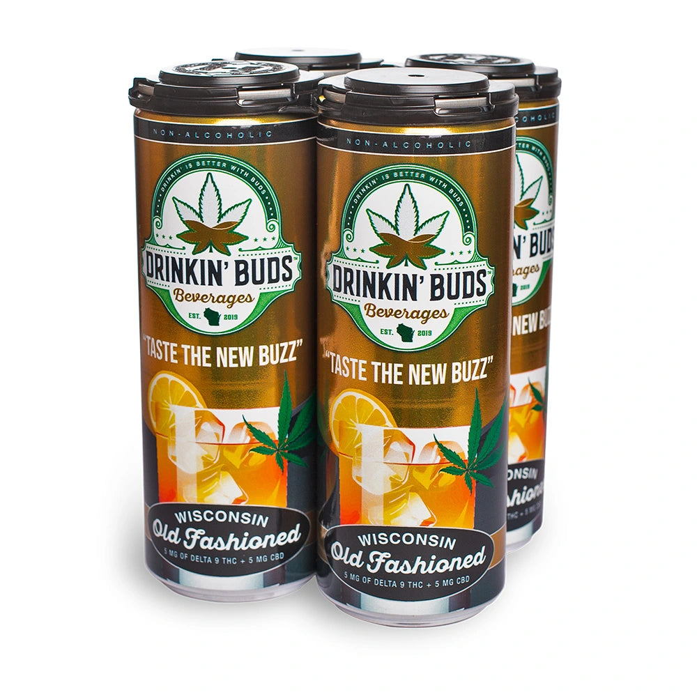 A four-pack of Drinkin’ Buds Wisconsin Old Fashioned cans, a non-alcoholic THC and CBD-infused beverage, featuring a cannabis leaf logo and an Old Fashioned cocktail illustration with lemon garnish.