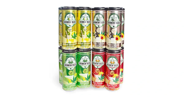 A stack of twelve colorful Drinkin' Buds THC-infused beverage cans in four flavors: Spiked Lemonade, Piña Colada, Margaritas, and Rum Punch.