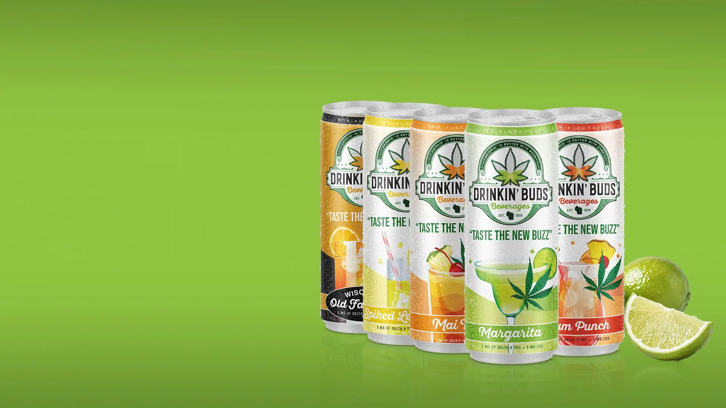 Four Drinkin' Buds beverage cans in a vibrant lineup, featuring flavors like Spiked Lemonade, Mai Tai, Margarita, and Rum Punch. Each can showcases cannabis leaf branding, promoting the tagline 'Taste the New Buzz,' with visible lime slices in the background for a zesty touch.