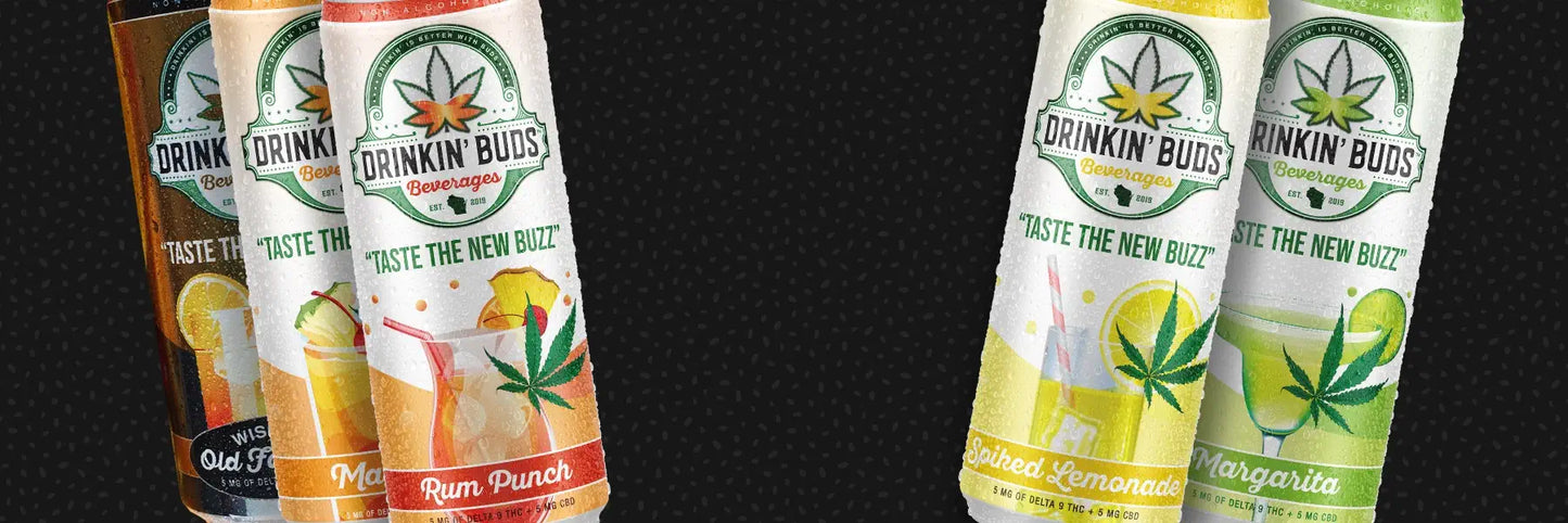 A variety lineup of Drinkin’ Buds Beverages featuring four flavors: Wisconsin Old Fashioned, Rum Punch, Spiked Lemonade, and Margarita. Each can displays a cannabis leaf logo, the slogan 'Taste the New Buzz,' and highlights the infusion of Delta-9 THC and CBD. The colorful drinks, accompanied by fruit garnishes, suggest refreshing and infused beverage options.