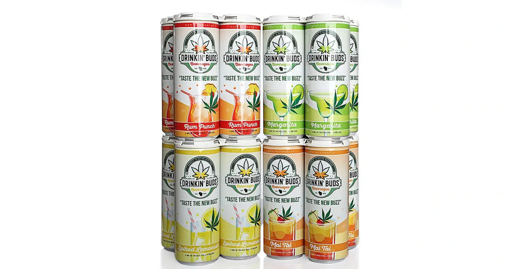 This image showcases a stacked arrangement of Drinkin' Buds beverages, featuring slim cans with various flavors: Rum Punch, Margarita, Spiked Lemonade, and Mai Tai. The label design includes cannabis leaves and the slogan "Taste the New Buzz," indicating these drinks contain Delta-8 THC. Each flavor is color-coded, aligning with its tropical or citrus profile.