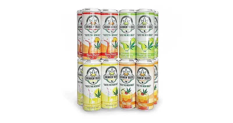 A stack of twelve Drinkin’ Buds cannabis-infused beverage cans arranged in three rows.